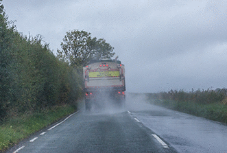 Other types of vehicle - You're following a lorry on a wet road. What should you do when spray makes it difficult to see the road ahead?