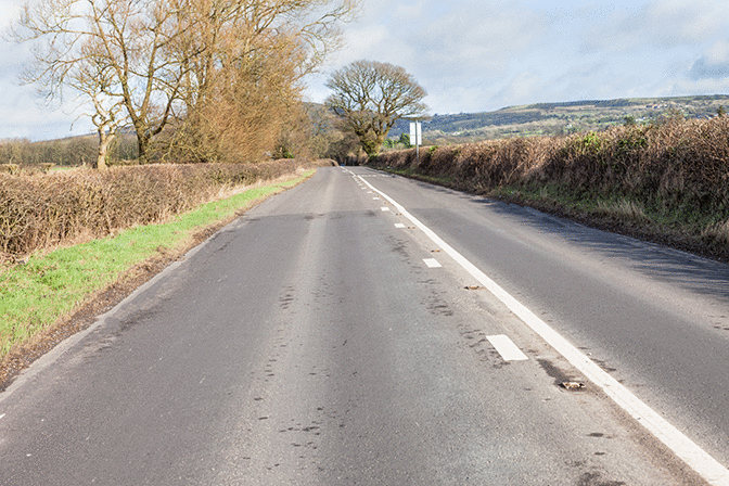 Rules of the road - You see these double white lines along the centre of the road. When may you park on the left?