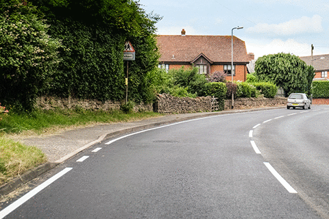 Hazard awareness - What does the solid white line at the side of the road indicate?