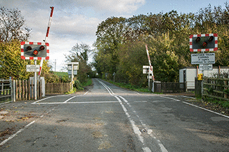 Hazard awareness - You're driving towards this level crossing. What would be the first warning of an approaching train?