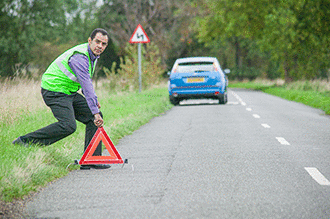 Incidents and emergencies - You've broken down on a two-way road. You have a warning triangle. At least how far from your vehicle should you place the warning triangle?