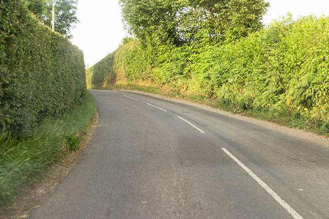 Hazard awareness - You're driving towards this left-hand bend. What danger should you be anticipating?