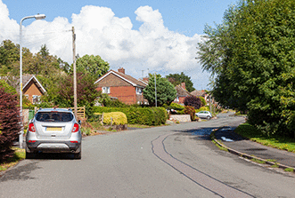 The road - You're about to pass this car. What's the main hazard you should be aware of?