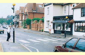 Hazard awareness - What should the driver of the car approaching the crossing do?