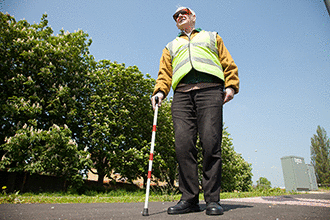 Vulnerable road users - You see a pedestrian carrying a white stick that also has a red band. What does this mean?