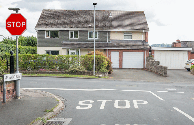 Road and traffic signs - Why does this junction have a 'stop' sign and a stop line on the road?