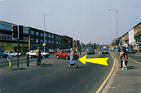 Hazard awareness - What should the driver of the red car (arrowed) do?