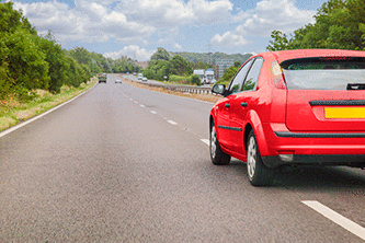 The driver - You're driving along this road. What should you do if the red car cuts in close in front of you?